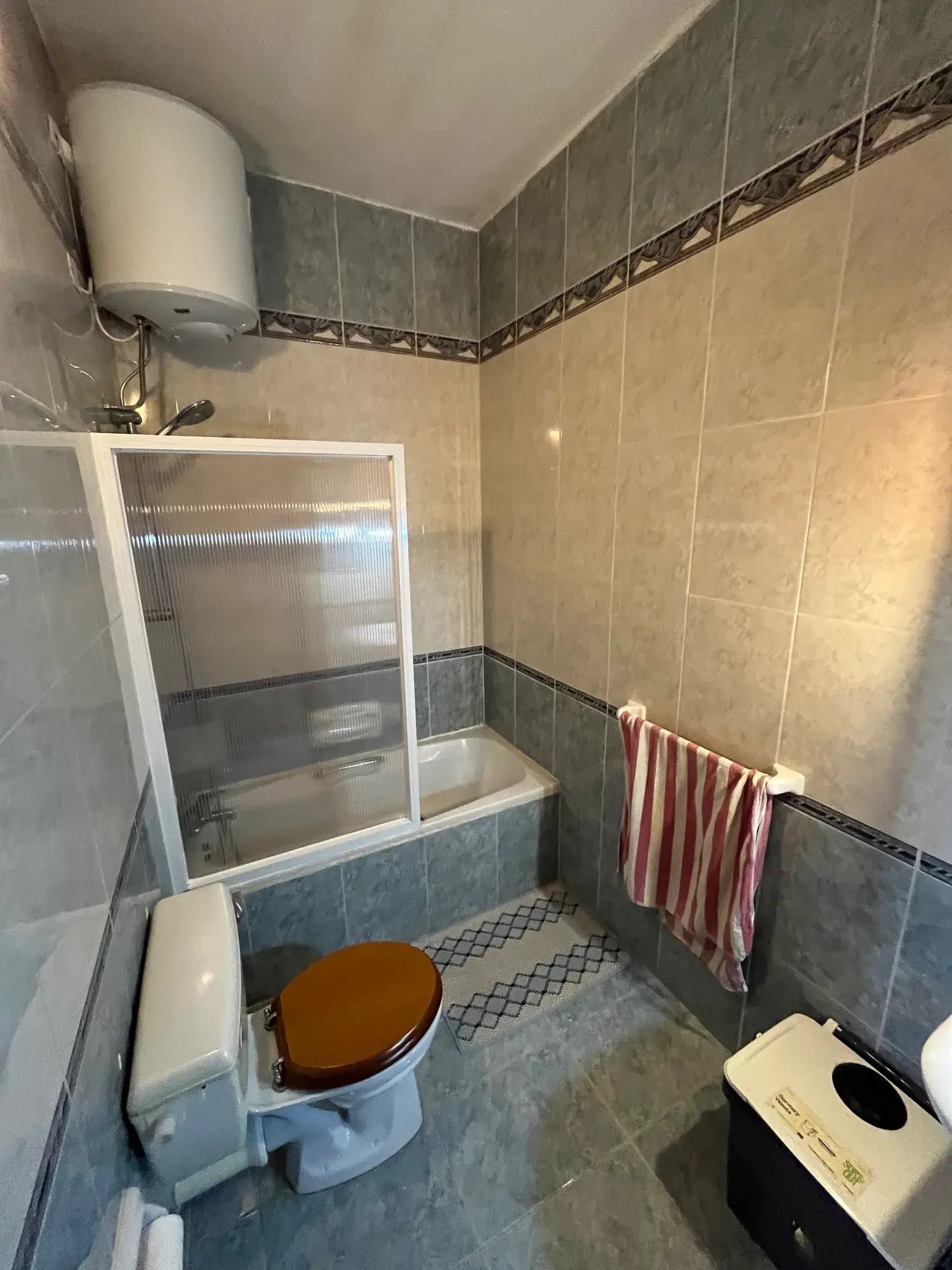 Tiled shower room at Sultana Apartment 8