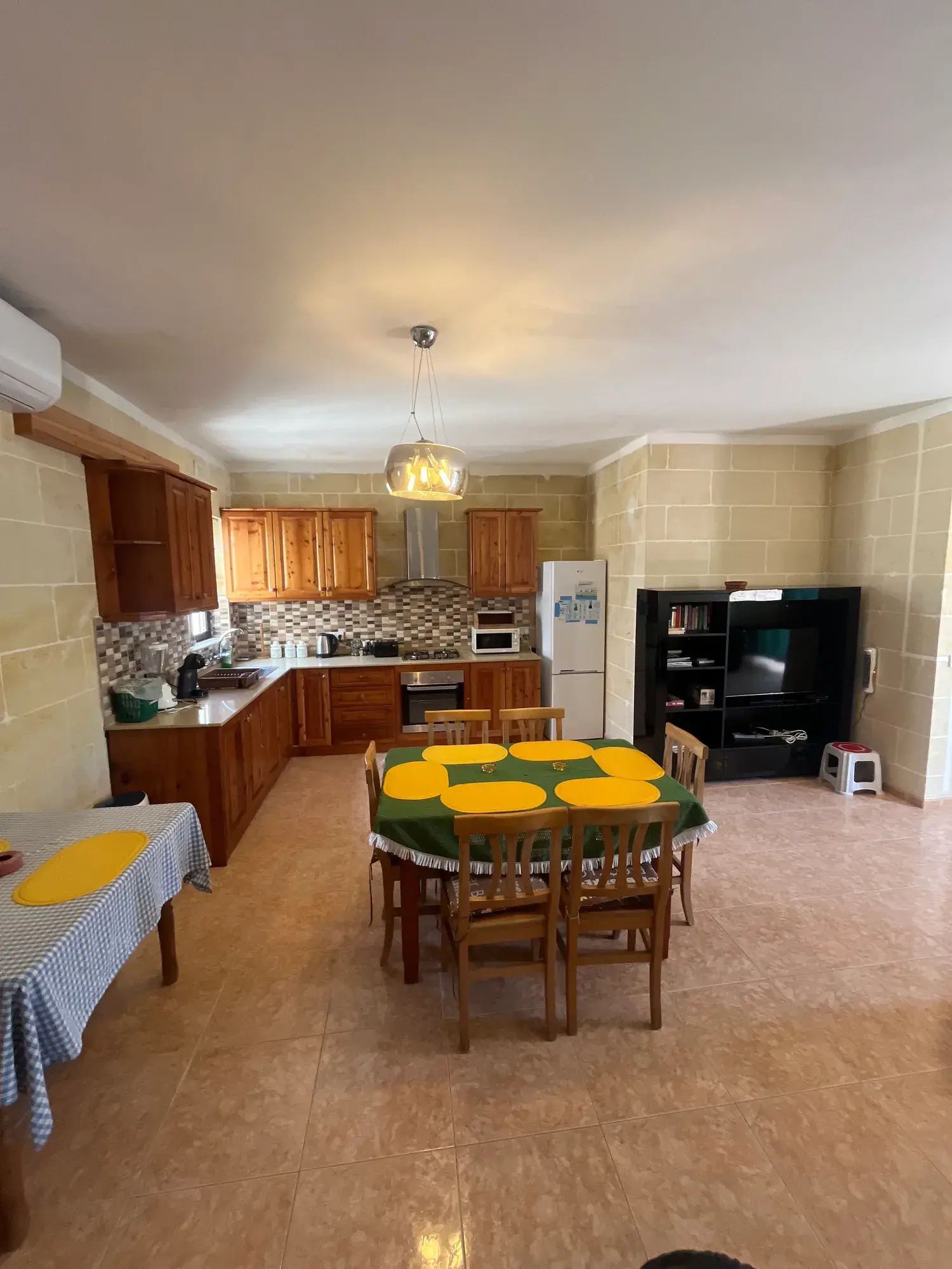 Open kitchen and dining area at Vicmar Penthouse