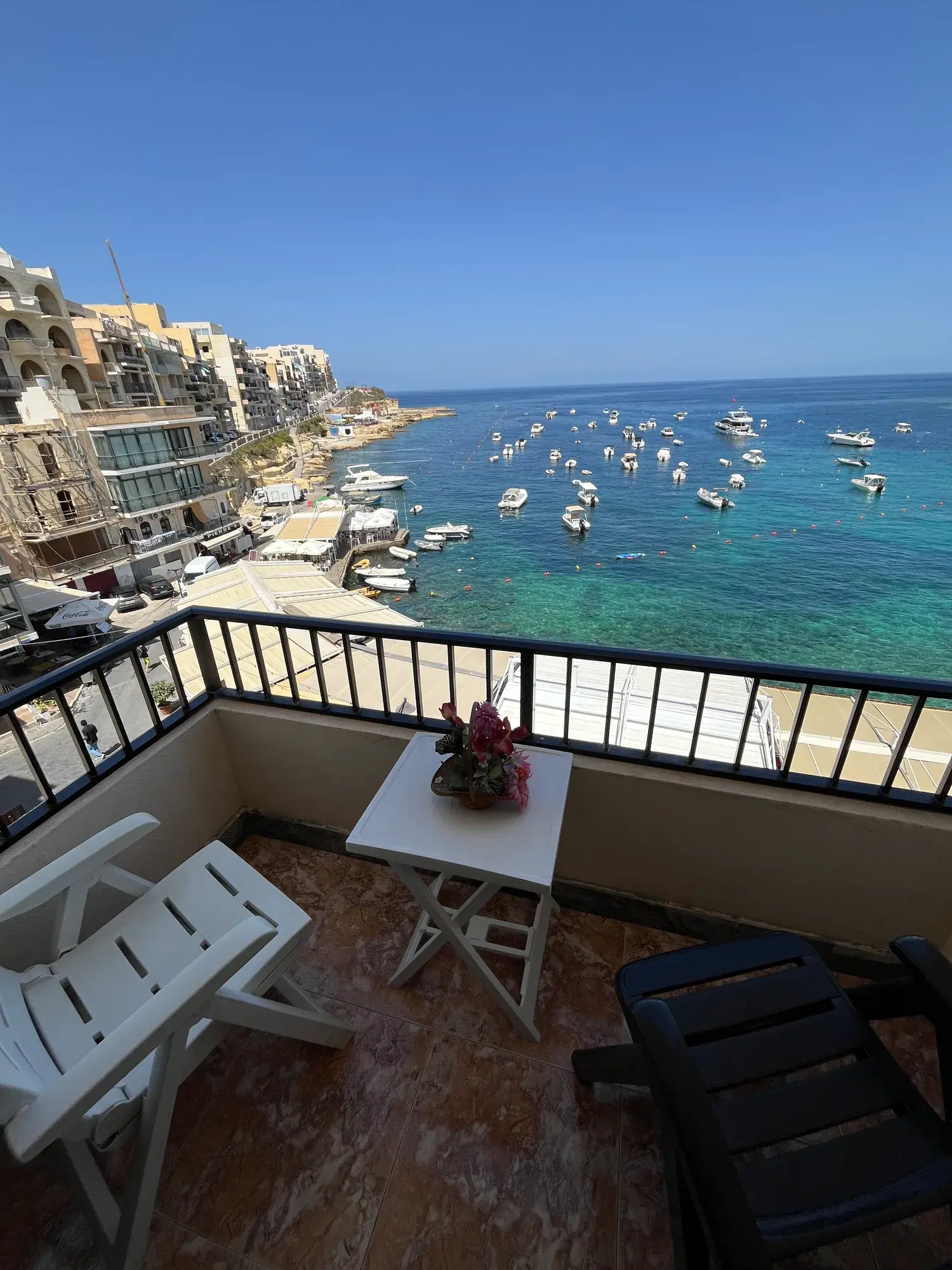 Table and chairs on the sea-view balcony at Sultana Apartment 5